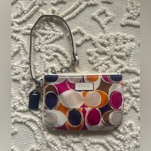 Coach wristlet, purple/orange. Used, like new.